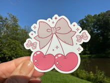 Load image into Gallery viewer, Sticker | H | Coquette Cherries with Bow | Waterproof Vinyl Sticker | White | Clear | Permanent | Removable | Window Cling | Glitter | Holographic