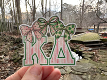 Load image into Gallery viewer, Sticker | KD | Kappa Delta Green Pink Bows | Waterproof Vinyl Sticker | White | Clear | Permanent | Removable | Window Cling | Glitter | Holographic