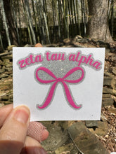 Load image into Gallery viewer, Sticker | ZTA | Zeta Tau Alpha Pink Bow | Waterproof Vinyl Sticker | White | Clear | Permanent | Removable | Window Cling | Glitter | Holographic