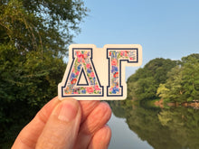 Load image into Gallery viewer, Sticker | DG_G | Delta Gamma | Waterproof Vinyl Sticker | White | Clear | Permanent | Removable | Window Cling | Glitter | Holographic