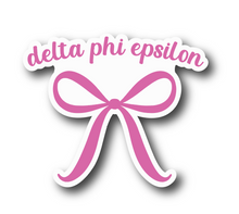 Load image into Gallery viewer, Sticker | D Phi E | Delta Phi Epsilon Pink Bow | Waterproof Vinyl Sticker | White | Clear | Permanent | Removable | Window Cling | Glitter | Holographic